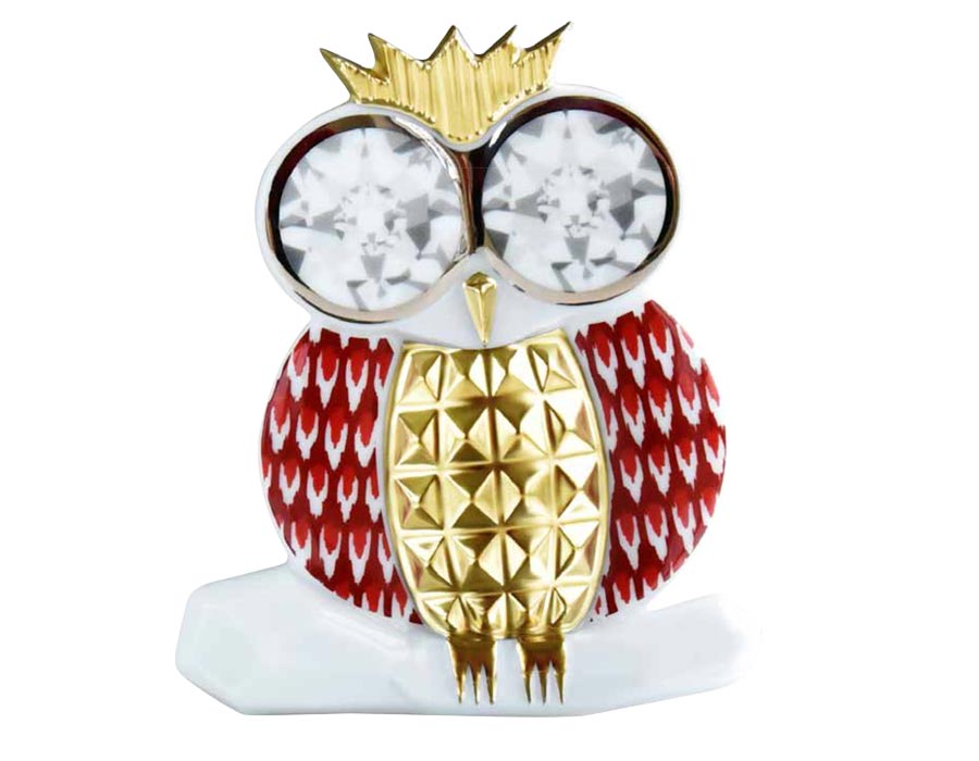A porcelain owl brooch done by Iris Apfel for Bernardaud